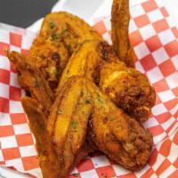 Whole Wing (Breaded) · 3 piece breaded whole wing tossed in any one of our wing sauces, or just original (plain), n...