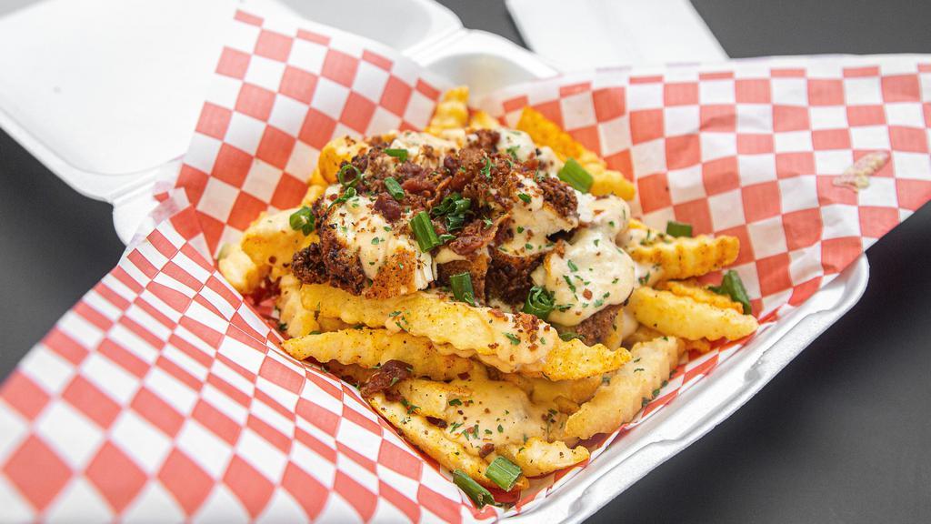 Loaded Fries W/ Chicken · Nacho cheese, chicken, bacon, green onions, and sour cream.