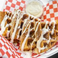 G Waffles · Original Belgium waffle topped with a cream drizzle and powdered sugar
