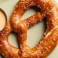 German Salt Pretzel W/ Cheese Sauce · Classic salt pretzel with our homemade cheese sauce. Spicy mustard will be substituted if ch...