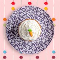 A Carrot Path · Carrot cake with cream cheese frosting and a frosted carrot on top.