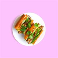 Grilled Chicken Banh Mi · Grilled chicken on a baguette with cucumber,  jalapeño,  pickled carrot, cilantro, green oni...