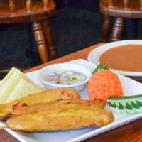 Chicken Satay · Grilled chicken on skewers, marinated with coconut milk and spices, served with peanut sauce...