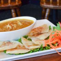 Roti · Thai flat bread served with yellow curry with onion, potato, pea, carrot.
