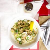 Linguini And Clams · House-made linguini,  clams, white wine, garlic, fresh herbs.