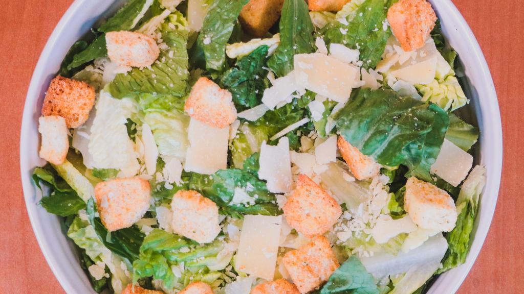 Caesar Salad · Romaine, olives, croutons, parmesan cheese, and Caesar dressing. Add protein, toppings for additional charges.