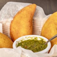 Empanadas De Carne, Pollo O Queso (Order Of 3 People) · Gluten-free Colombian empanadas stuffed with meat and potato.