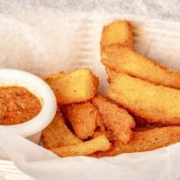 Yucca Frita · Yucca fries served with a side of salsa criolla.