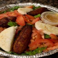 House Salad · Fresh romaine lettuce with tomatoes, peppers, black olives, sweet plantain and fried arepa. ...