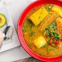 Sancocho · This is an authentic Colombian soup. Served with green plantain, yucca, potatoes, corn and c...
