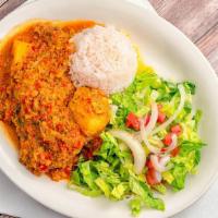 Pollo Guisado · A quarter of chicken cooked with a delicious salsa criolla, yucca and potato. Served with ri...