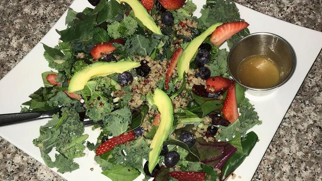 Quinoa Kale Salad · Kale, quinoa, cranberry, blueberry, avocado and lemon zest dressing. Calories 283, protein 12, fat 10, carbs 46.