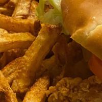 Fried Chicken Sandwich · Chicken breast deep fried  served on a bun with lettuce, tomatoes, pickles,  onions and mayo...