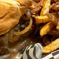 Meatloaf Sandwich · All beef meatloaf served on a bun with gravy and sautéed  onions. Complete with a side of fr...