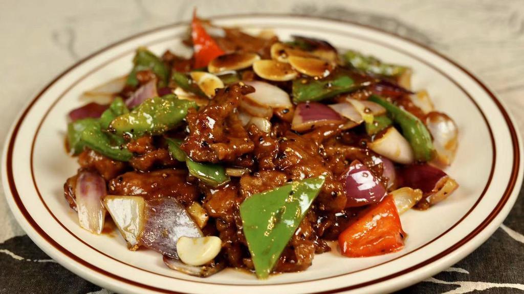 Black Pepper Beef · Spicy.  Stir fried beef & bell pepper mix with black pepper sauce.
