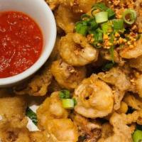Salt And Pepper Calamari · Fried calamari tossed with salt and pepper, fried garlic chips and green jalapenos and serve...