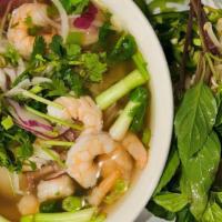 Shrimp Pho · Shrimp, rice noodles, cilantro, basil, bean sprouts and sliced onions served in a savory bee...