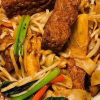 Drunken Noodles · Wide rice noodles stir fried with basil and vegetables.