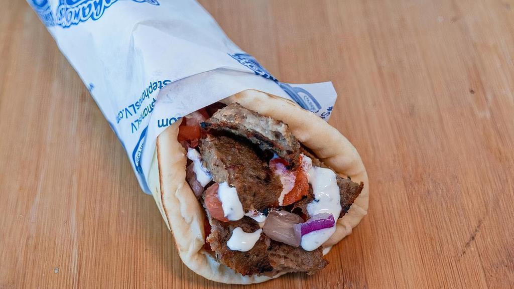 Beef & Lamb Gyro Wrap · Our most popular wrap. Sliced gyro wrapped in pita bread with tomatoes, onions, and tzatziki sauce.