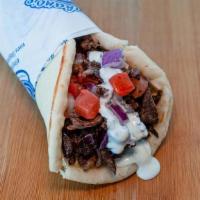 Doner Wrap(Beef) · Slices of beef wrapped in pita bread with tomatoes, red onions, garlic sauce and tzatziki sa...