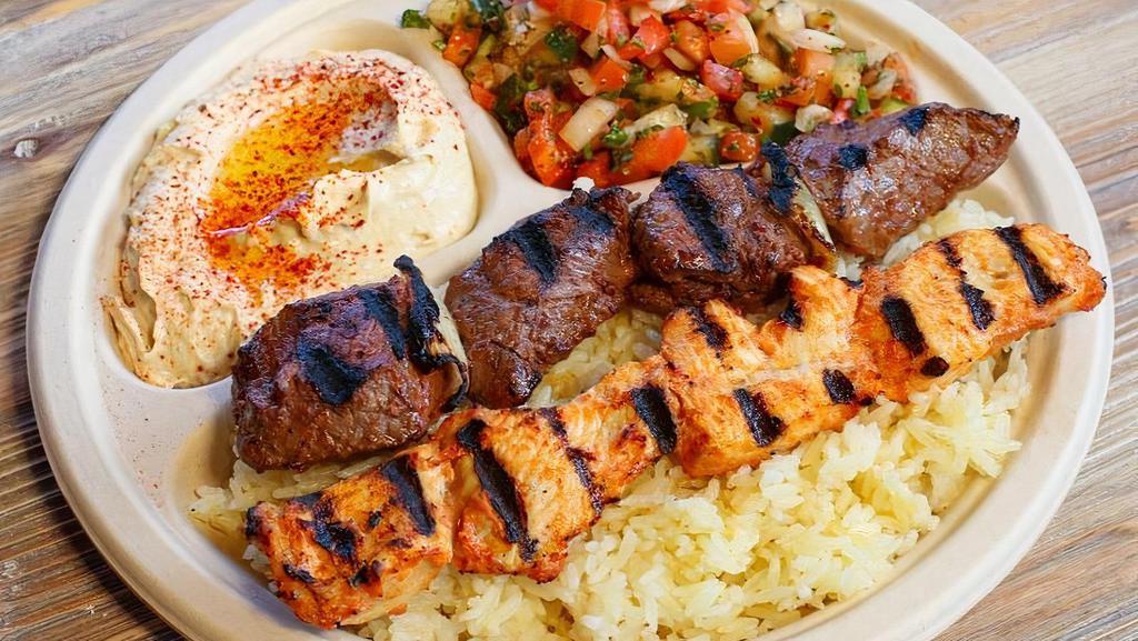 Combo Plate · Choose two kebabs or meats. Served with hummus, Israeli salad, rice, and two pieces of pita bread.