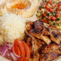 Chicken Shawerma Plate · Chicken leg and thigh sliced from a vertical spit. Served with tahini and garlic sauce, humm...