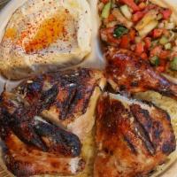 1/2 Flame Grilled Chicken Plate · Four pieces half flame grilled chicken marinated with lemon and garlic. Served with hummus, ...