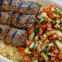 Kofta Kebab Bowl · 2 piece ground beef kebabs  served with rice, Israeli salad and pita.