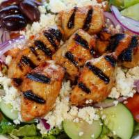 Chicken Kebab Salad · Served with lettuce, tomatoes, onions, cucumbers, feta cheese, olives, and two pieces of pit...
