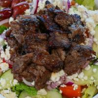Beef Shawerma Salad · Served with lettuce, tomatoes, onions, cucumbers, feta cheese, olives, tzatziki or tahini sa...