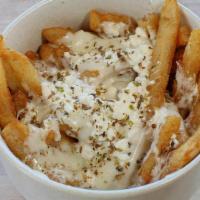 Cheese Fries Feta · Topped with melted feta, mozzarella, and oregano. Seasoned and served with our secret fry sa...