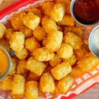 Dippin-Tots · Large basket salted tots with choices of BBQ, Ranch and  ketchup Sauces.
