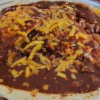 Huevos Rancheros (1/2 Order) · One egg, hash browns, beans, or fried potatoes on top of a flour or 1-corn tortilla, smother...