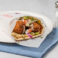 Falafel Wrap · Garbanzo beans ground with parsley, onions and special spices and fried. Wrapped in pita bre...