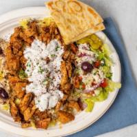 Chicken Gyro Plate · Chicken gyro, hummus, salad, and rice with tazatziki sauce on top and served with pit a bread.