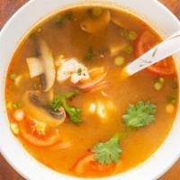 Tom Yum (Thai Spicy & Sour Soup) · Spicy. Mushrooms, tomatoes, lemongrass, galanga, kaffir lime leaves, onions, cilantro, hot c...