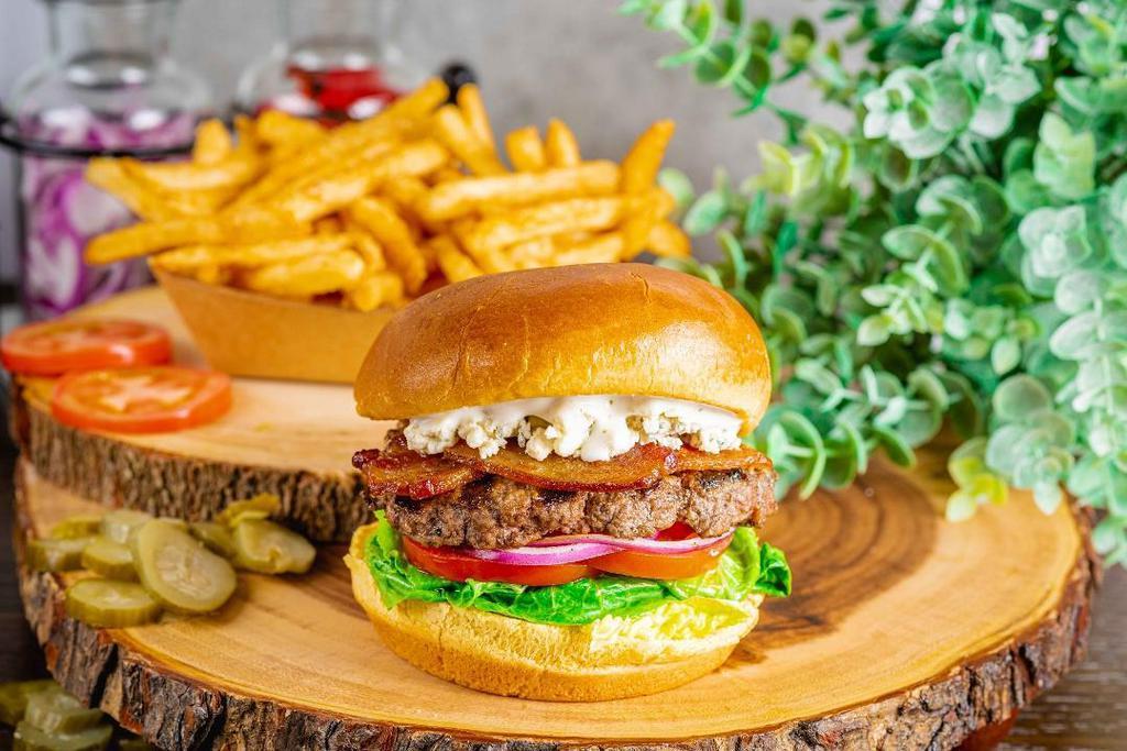 Bacon Blue Burger · Bacon, blue cheese crumbles, lettuce, tomato, onion, and ranch.  Burgers are certified Angus beef, flame-grilled, cooked to 160 degrees, and served on a brioche bun with a side of seasoned messiah fries.