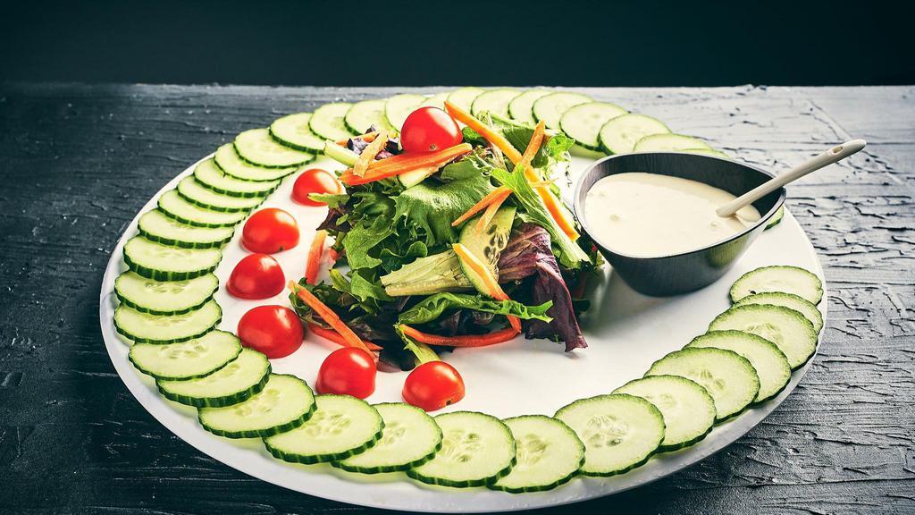 House Salad · Spring Lettuce, Chopped Romaine, Cherry Tomatoes, Cucumbers, Shredded Carrots.