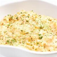 Batatas Gratinadas (Au Gratin Potatoes) · Sliced potatoes baked in a cheddar cheese sauce.