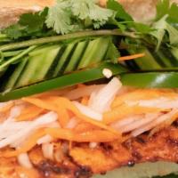 Vietnamese Grilled Sandwich With Grilled Pork · Served with cilantro, pickled carrots, and radish, cucumber, jalapeños and mayonnaise.
