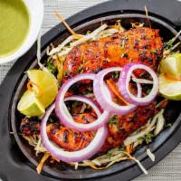 Tandoori Chicken · Delicious chicken legs marinated with indian spices and cooked on a slow flame tandoor. Famo...