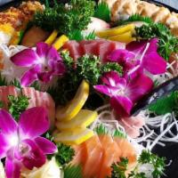 Fuji Sushi Platter · 15 pcs Sashimi, 10 pcs Nigiri w/California Roll, Spicy Tuna Roll Crunch Roll, Rainbow Roll.