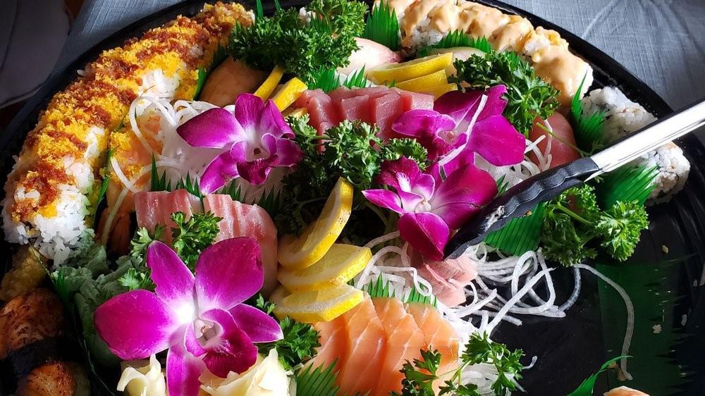 Fuji Sushi Platter · 15 pcs Sashimi, 10 pcs Nigiri w/California Roll, Spicy Tuna Roll Crunch Roll, Rainbow Roll.