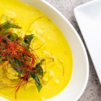 Yellow Curry · Traditional Thai yellow curry paste cooked in coconut milk, turmeric powder with potatoes an...