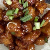 Orange Chicken · Deep fried chicken topped with orange sauce and sesame seed.