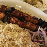 Chicken Breast Kabob · Kabobs served with vegetables over rice.
