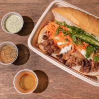 The Bb Special Banh Mi · Braised pork belly, grilled pork and an egg in a Baguette. Served with sauteed scallions, ho...