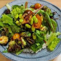 Seasonal Green Salad · Tomatoes, crispy brussels sprouts.