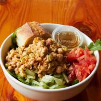 Vegan Veggin' Heaven Salad · Vegan Garbanzo Bean Salad, Tomato and Cucumber on Seasonal Lettuces.  Served with Italian Vi...