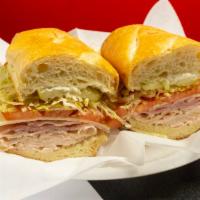 Americano Sandwich · Turkey, ham and American cheese. Garnished with lettuce, tomato, onion, mustard, mayonnaise,...